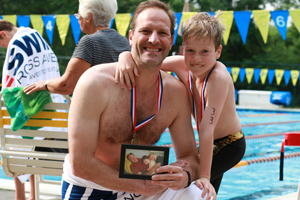 Teddy Meyer swimming with his dad Scott in honor of his grandfather