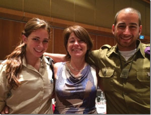 Jill (center) and her children Sara and Eric enjoy the best kind of close encounter –family togetherness. Operation Warm Embrace brought lone soldier parents and their combat soldier children together for a weekend of hugs.