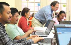 An instructor from Westchester Community College teaches an adult computer class.