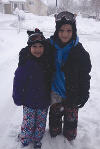 Theresa and Anthony Kosakowski, ages eight and 10 respectively, enjoying outdoor fun during a a snow day in Armonk.