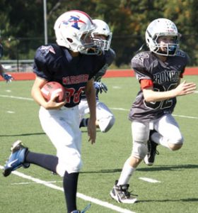 The versatile Joe Weiner #26 played a big role in the success of the Armonk Warriors as running back, tight end, defensive end and linebacker. Photo by Shari Fruhling
