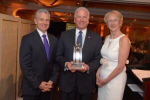 From left, Anthony Justic, chairman of The BCW Board of Directors; William Flooks Jr., funeral director at Beecher Flooks Funeral Home and Marsha Gordon, president and CEO of The BCW.