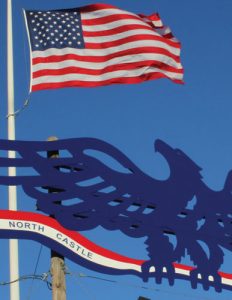 The American Flag and the North Castle Eagle, symbols of the majestic beauty and great strength of our nation.