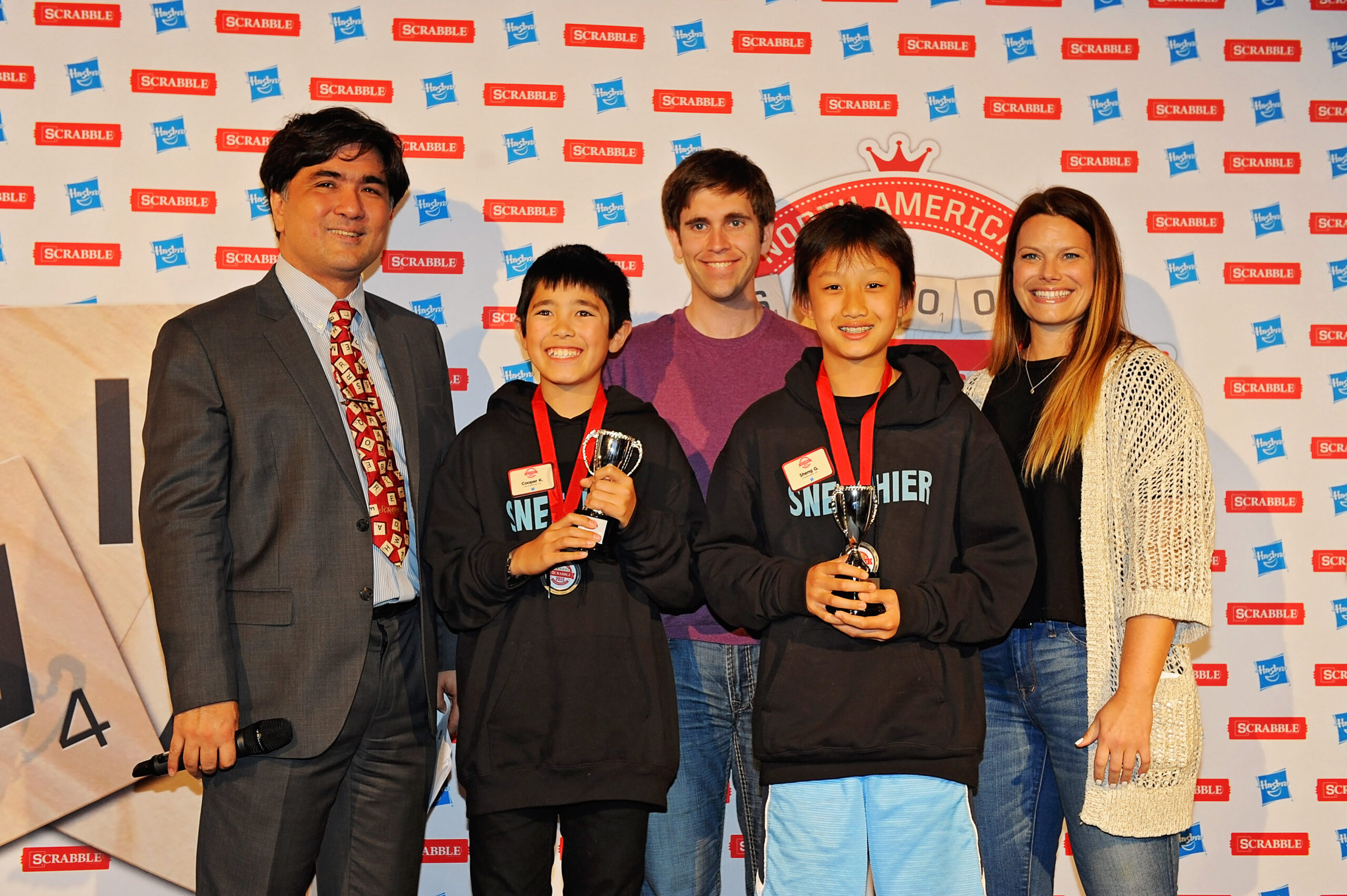 L-R: John Chew, Co-president of the North American SCRABBLE Players Association; Cooper Komatsu, 7th grader from Los Angeles; Conrad Bassett-Bouchard, 2014 National SCRABBLE Champion; Sheng Guo; and Danielle Armbrust, Senior Director Global Brand Marketing and Strategy at Hasbro / Photo credit: Patricia A Hocker, NASPA