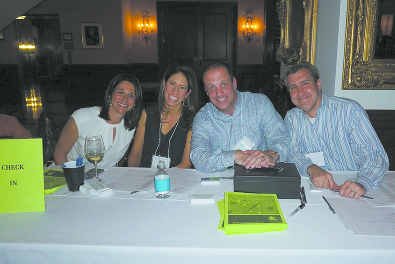 Volunteers (l-r): Nona Ullman, Alicia Kalish, Adam Solomon and David Schreiber at a recent Chappaqua School Foundation fundraiser