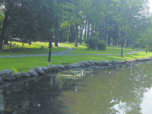 Wide pathways run alongside the water at picturesque Wampus Brook Park.