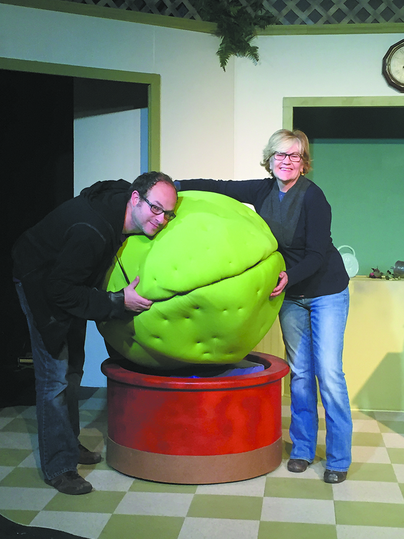 Adam David Cohen (Artistic Director) and Ann Shankman (Artistic Direc- tor of the Community Stage) with Audrey II of October/November 2015's Little Shop of Horrors.