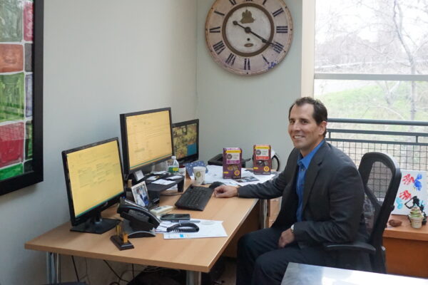 At his desk with Greyston Bakery products: Mike Brady, CEO and president, Greyston Foundation
