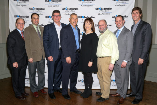 (From left) Richard Leroy of Briarcliff Manor, Carl Finger of Scarsdale, Jeff Kapelus of New Rochelle, New York Yankees Manager Joe Girardi, Barbara Bel of Scarsdale, David Perlmutter of Chappaqua, Scott Zemachson of Scarsdale, and Ken Fuirst of Chappaqua.