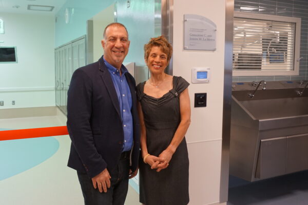 Geraldine C. and Joseph M. LaMotta outside the operating room named for them.