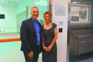 Geraldine C. and Joseph M. La Motta outside an operating room named for them