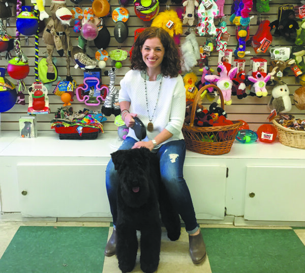 Inside Wags and Whiskers on King Street: Chappaqua's Tracey Appel with Charlie, a Kerry Blue Terrier