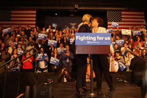 Congresswoman Nita Lowey embraces Hillary Clinton after rallying for her right before her speech to supporters.