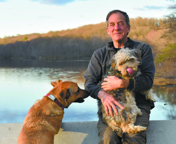 Shapera with his dogs, Ruby and Rico, on Pocantico Lake.