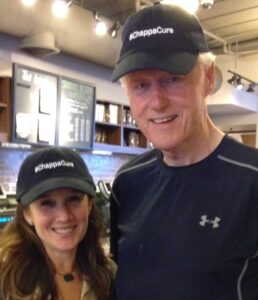 Kim Gilman and Bill Clinton wearing #ChappaCure Hats available for purchase.