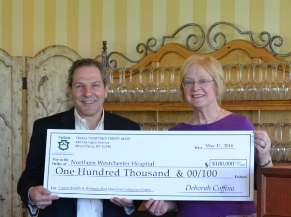 Twigs President Maureen Kilfoyle presenting the $100,000 donation to Joel Seligman, NWH president and CEO.