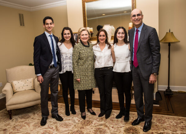Tracy Stein (to the right of Hillary Clinton) and her family during an April fundraiser inside her home.