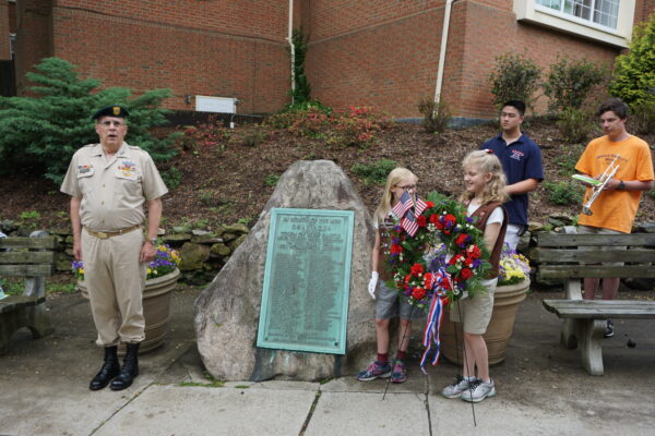 Parade Marshal: Captain James McCauley, Jr. with Holly Hulme and Charlotte LePage of Chappaqua Girl Scout Troop 2576 and members of the Horace Greeley High School Bugler