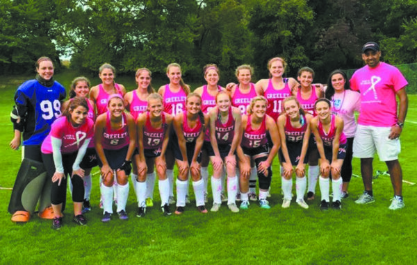Greeley Field Hockey team wearing special pink jerseys in order to raise money for Breast Cancer research.