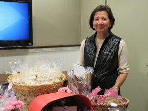 Fran Seeve managing a bake sale at the Shop for a Cause