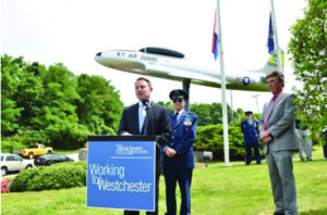 Westchester County Executive Robert P. Astorino; Lt Col Joseph Wooley, Civil Air Patrol; Peter Scherrer, Westchester County Airport at a rededication ceremony this past July for the Lockheed T-33 jet, known as the “T-Bird” after the WWII plane was restored for a year. Photos Courtesy of the Office of the Westchester County Executive