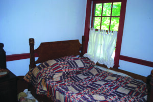 A rope bed in the bedroom of Smith’s Tavern.