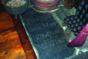 A tombstone was reused in the floor of Smith’s Tavern.